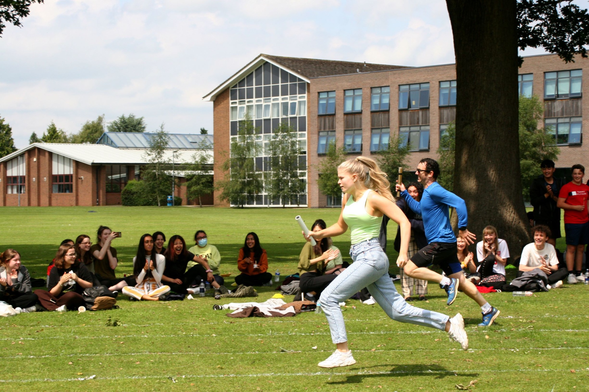 Student and Head Teacher running on Sports Day